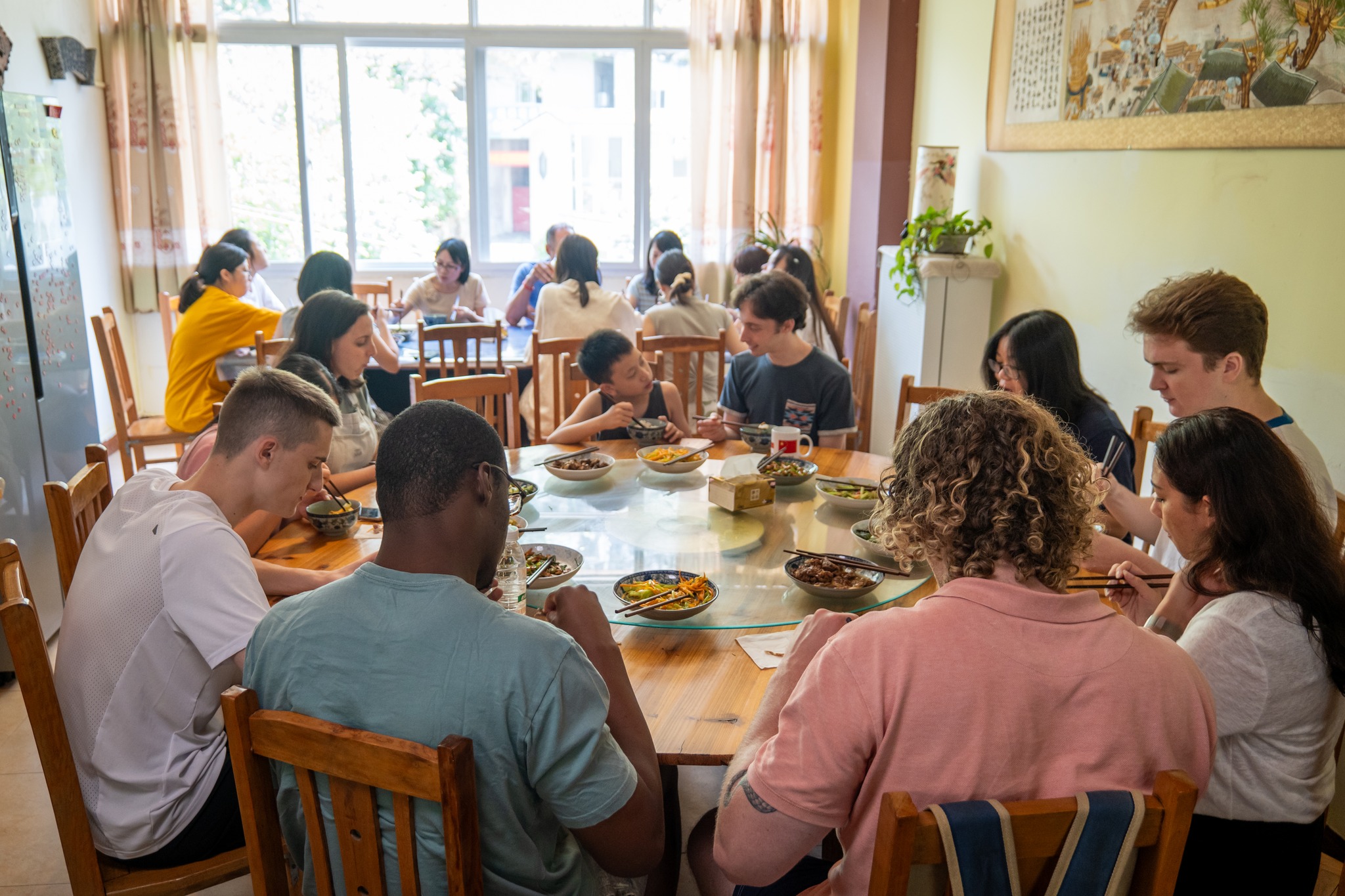 Students and teachers sharing a meal at the CLI Center in Guilin