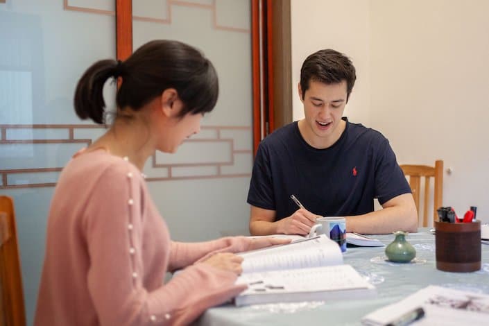 a CLI teacher and student during Chinese class