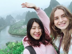 Two smiling women take a selfie above the Li River