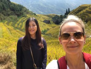 Two women take a selfie above the Longji rice terraces