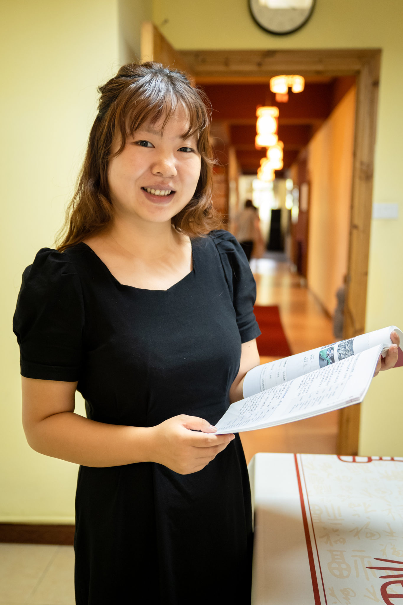 CLI student studying Chinese at a desk with textbooks and notes