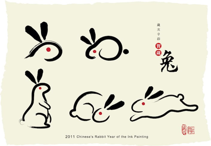 an ink painting depicting several simply drawn rabbits and the chinese character for rabbit