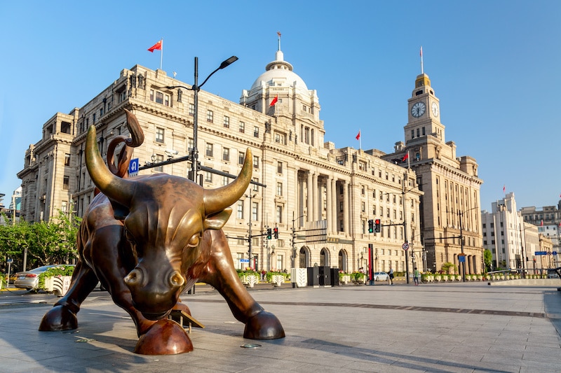 Bronze bull on The Bund in Shanghai Iron bull statue in front of Chinese banks on the Waitan Bund promenade