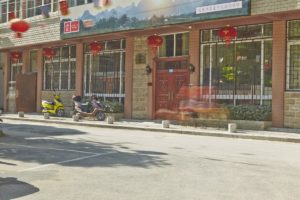 The front of the CLI Center building on a quiet street