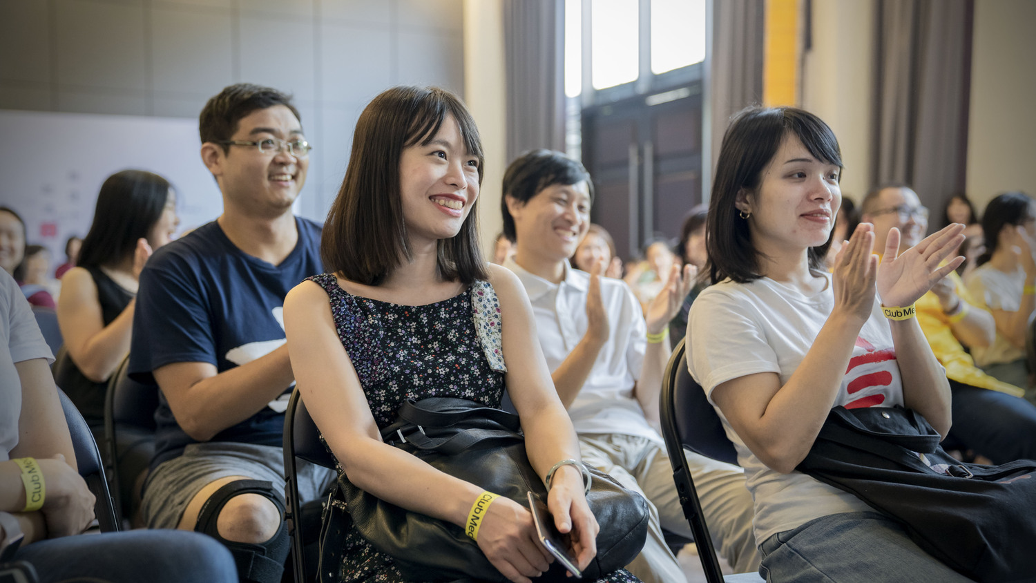 Students applauding during a presentation at CLI