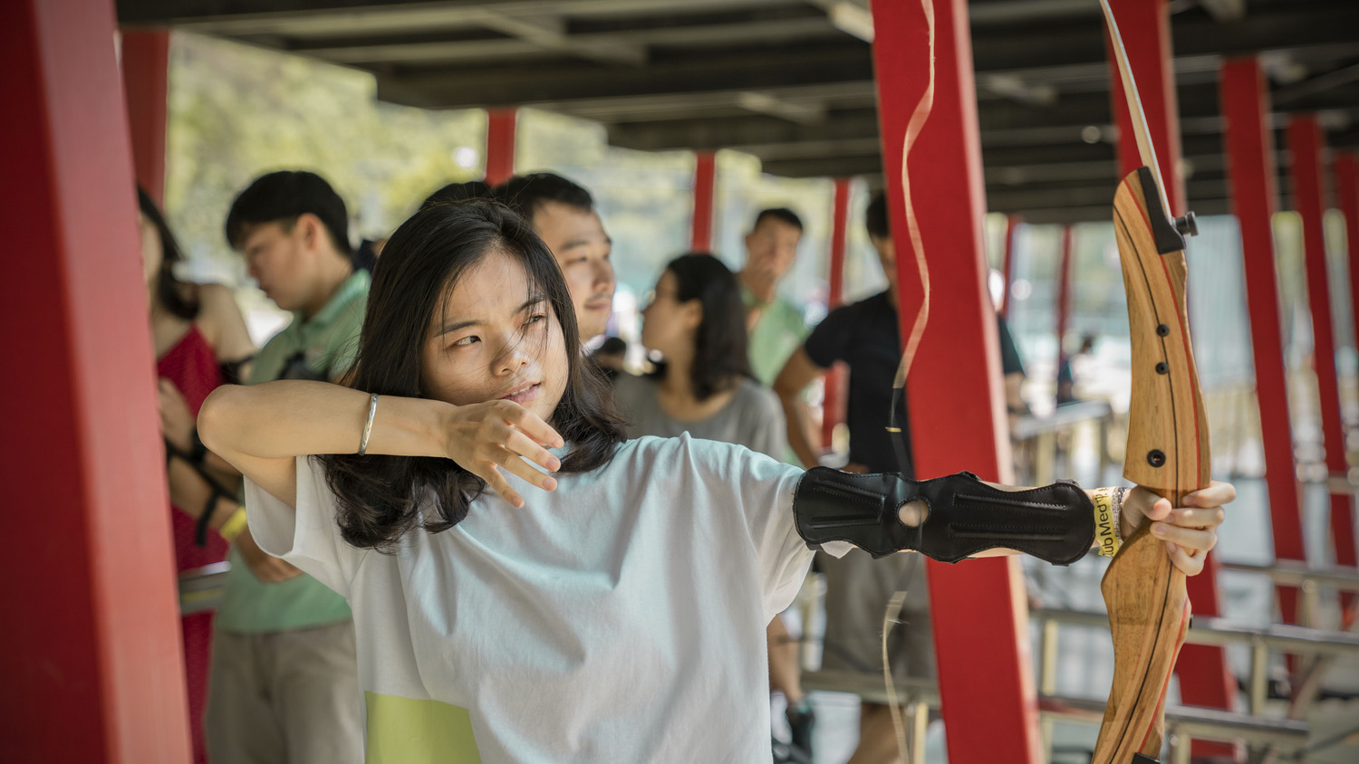 Chinese woman holding bow and arrow