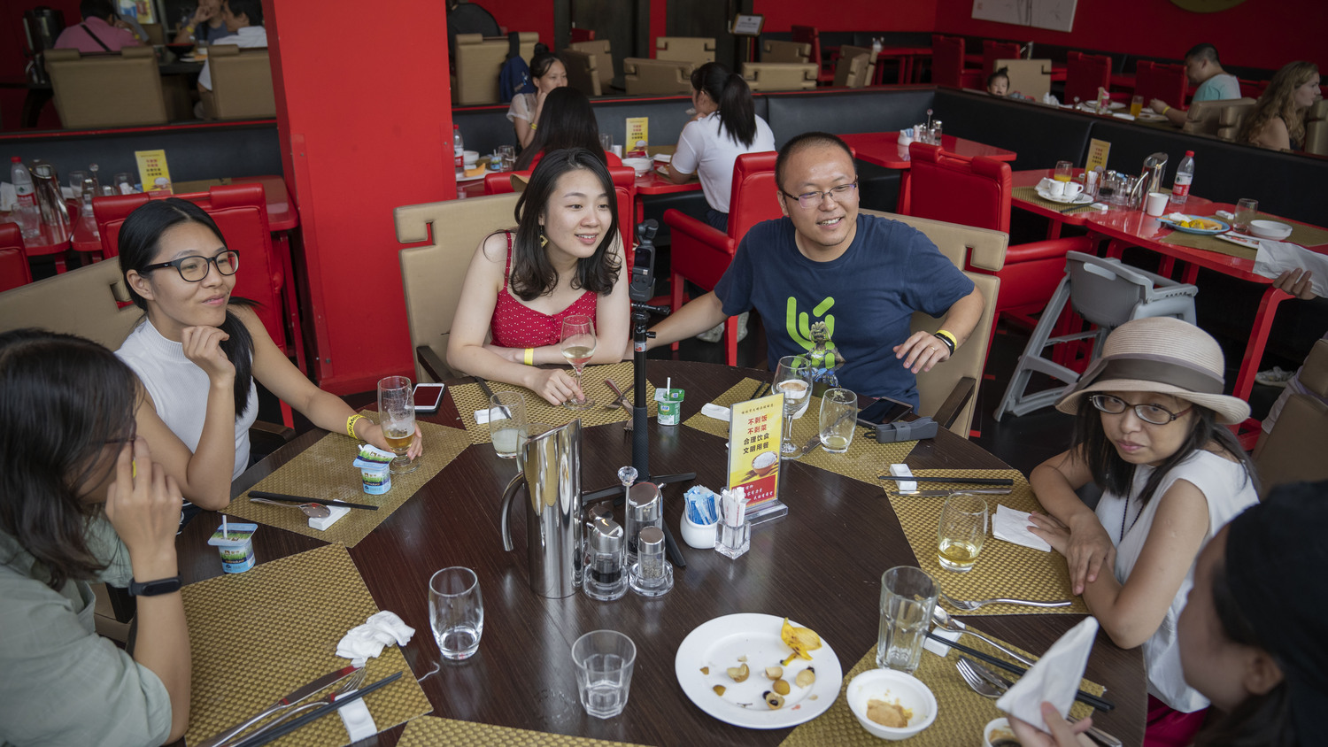 A group dining together around a round table in China