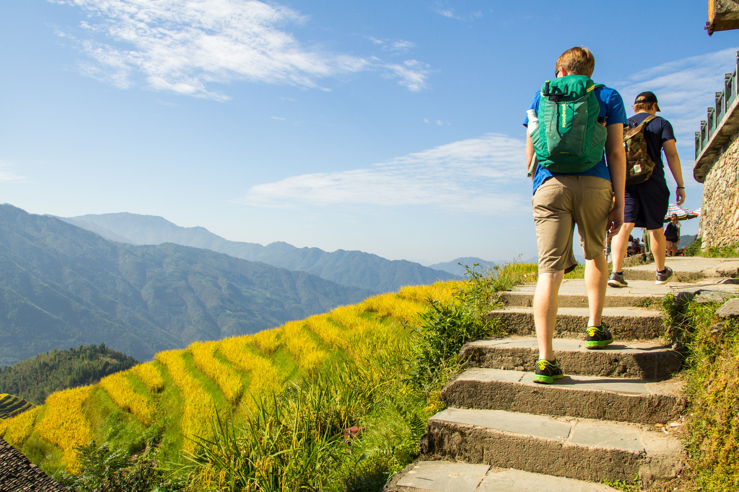 Hikers climbing stone steps
