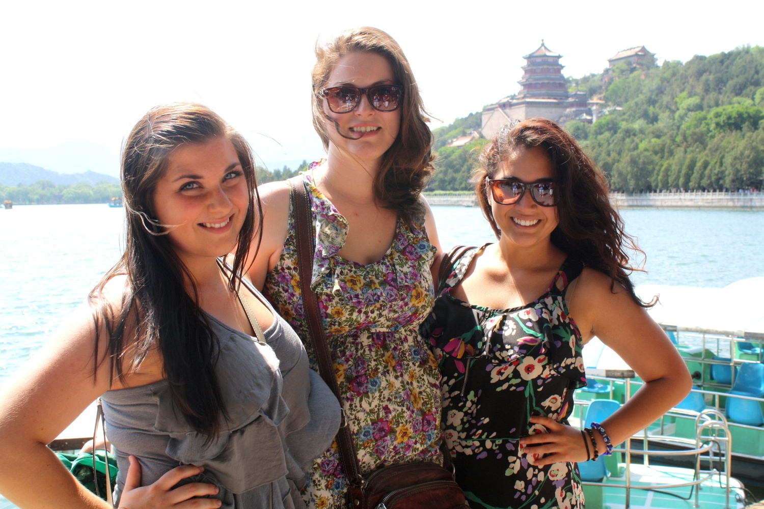 Program group traveling by boat along a river in southern China