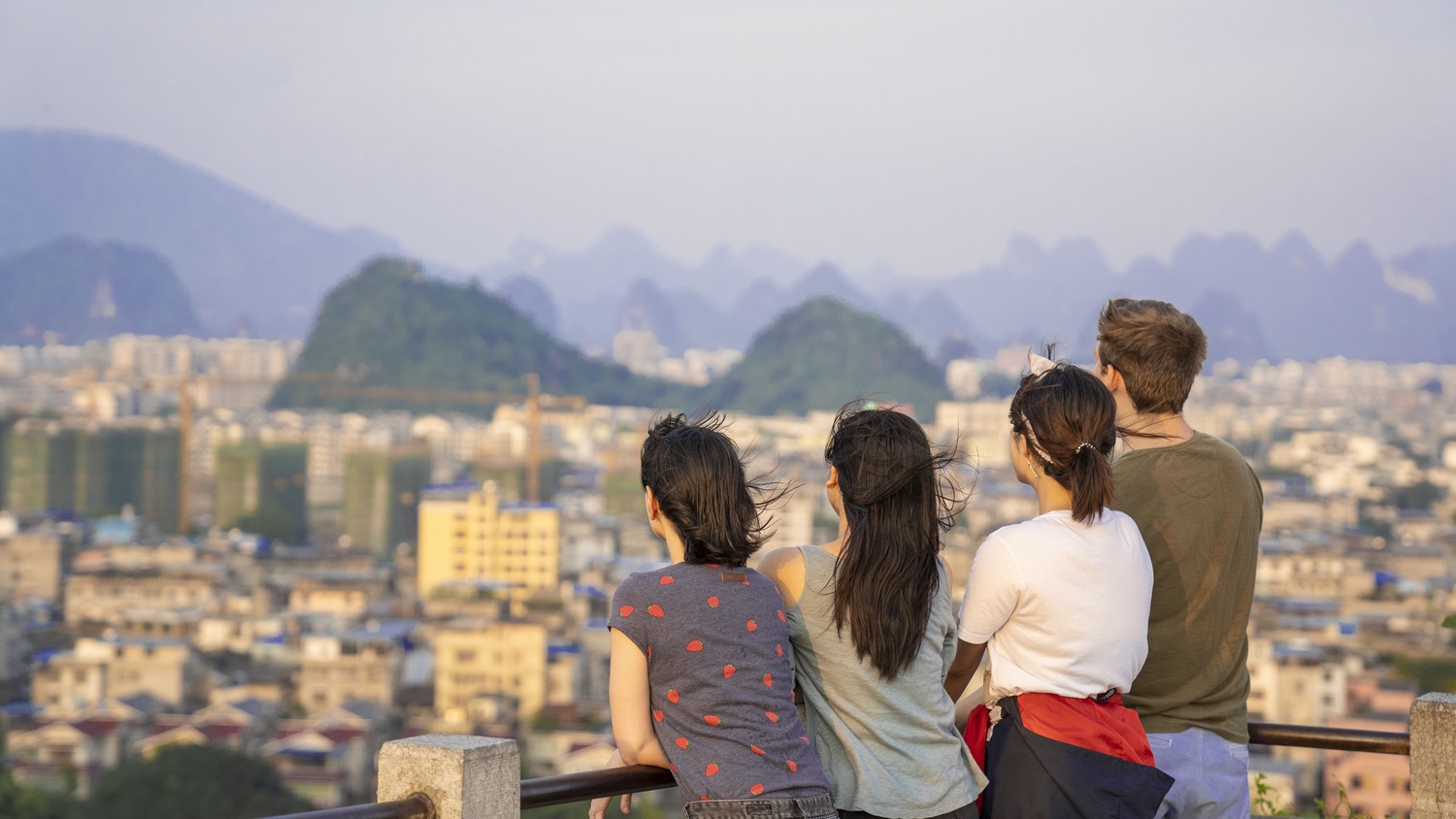 Students overlooking the Guilin skyline